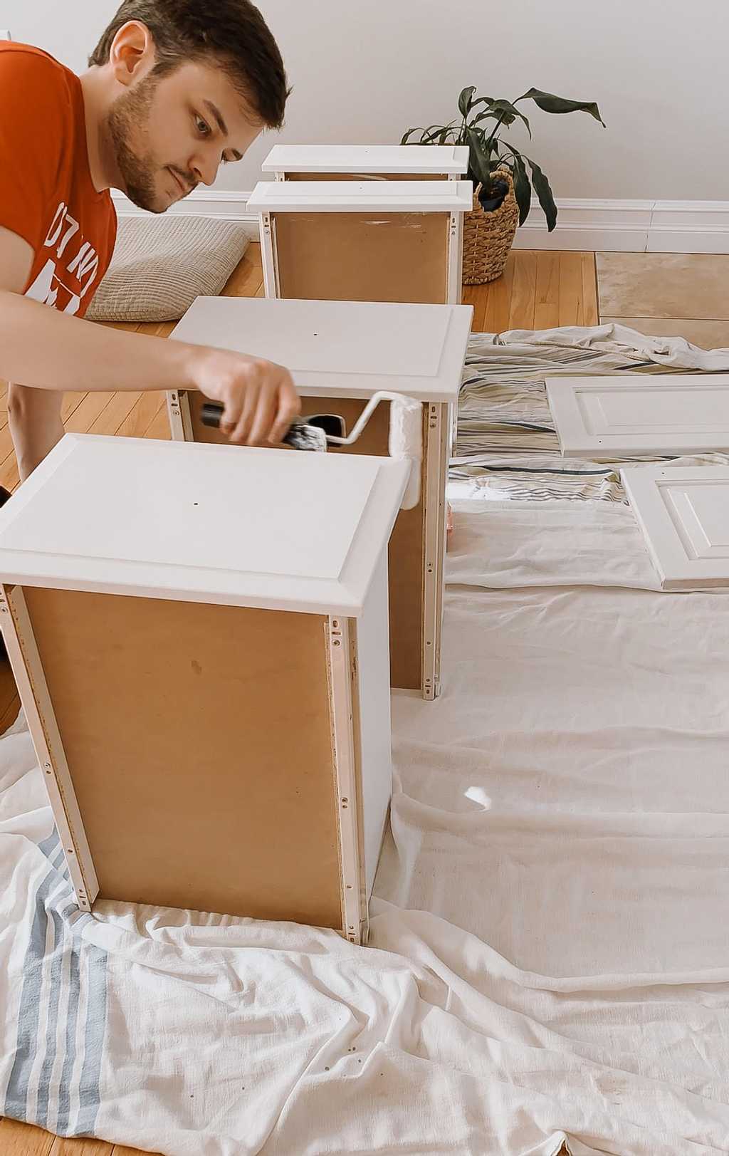 Use a roller where you can to get a smooth finish painting the cabinet drawers